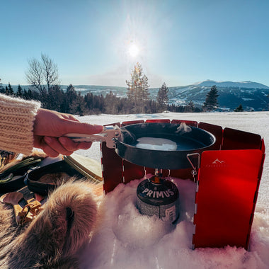 Vindskjerm til brenneren